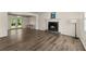 Spacious living room with fireplace, new flooring and access to outdoor area at 282 Oak Rdg, Auburn, GA 30011