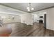 Open concept living room with hardwood floors leading into the kitchen at 282 Oak Rdg, Auburn, GA 30011