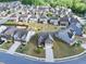 Aerial view showcasing the neighborhood with well-maintained homes and green spaces at 3477 Ivy Birch Way, Buford, GA 30519