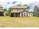 Expansive backyard with a covered patio and lush green grass, perfect for outdoor activities at 3477 Ivy Birch Way, Buford, GA 30519