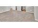 Carpeted basement featuring an unfinished area and a doorway at 3477 Ivy Birch Way, Buford, GA 30519