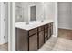 Spacious bathroom featuring a double sink vanity with dark wood cabinets and a bright white countertop at 3477 Ivy Birch Way, Buford, GA 30519