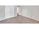 Bedroom with neutral colored walls, a plush carpet, and plenty of closet space at 3477 Ivy Birch Way, Buford, GA 30519