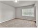 Bedroom featuring carpeted floors, neutral walls, and a window at 3477 Ivy Birch Way, Buford, GA 30519