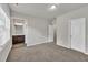 Bedroom with carpeted floor, light gray walls and view to the bathroom at 3477 Ivy Birch Way, Buford, GA 30519
