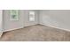 Bedroom featuring neutral walls, carpeted flooring, and natural light from the two windows at 3477 Ivy Birch Way, Buford, GA 30519