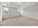 Large bedroom featuring carpeted floors, neutral walls and tray ceiling at 3477 Ivy Birch Way, Buford, GA 30519