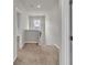 Hallway with carpet and a view of the banister overlooking the downstairs at 3477 Ivy Birch Way, Buford, GA 30519