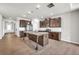 Modern kitchen with stainless steel appliances, granite countertops, and dark wood cabinets, plus a large island at 3477 Ivy Birch Way, Buford, GA 30519