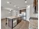 Spacious kitchen with stainless steel appliances, granite countertops, large island with sink and dishwasher at 3477 Ivy Birch Way, Buford, GA 30519