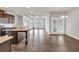 Bright, open-concept kitchen featuring a large island, stainless appliances, and an adjacent sitting area at 3477 Ivy Birch Way, Buford, GA 30519