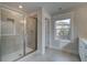 Bathroom featuring a glass shower enclosure, window and tile flooring at 4032 Andover Cir, Mcdonough, GA 30252