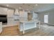 Gourmet kitchen with a center island, stainless steel appliances, and custom cabinetry at 4032 Andover Cir, Mcdonough, GA 30252