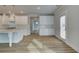 Bright kitchen with an island, stainless steel appliances, and a view into the adjacent dining area at 4032 Andover Cir, Mcdonough, GA 30252