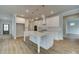 Gourmet kitchen featuring a center island, stainless steel appliances, and views into the living spaces at 4032 Andover Cir, Mcdonough, GA 30252