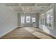 Bright living room featuring coffered ceilings, wood-look floors, and an abundance of natural light at 4032 Andover Cir, Mcdonough, GA 30252