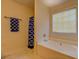 Relaxing bathroom with a garden tub, soft lighting, and private window at 265 Oak Hill Dr, Covington, GA 30016