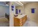Bathroom features an extended vanity area, bright lighting, and tile accents at 265 Oak Hill Dr, Covington, GA 30016
