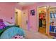 Bright bedroom with a charming reading nook and a peek into an organized closet at 265 Oak Hill Dr, Covington, GA 30016