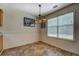 Charming dining area with a decorative light fixture and large windows at 265 Oak Hill Dr, Covington, GA 30016