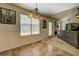 Bright dining area featuring a chandelier and view to the fireplace at 265 Oak Hill Dr, Covington, GA 30016