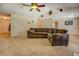 Open-concept living area with a large sofa and view to the kitchen area at 265 Oak Hill Dr, Covington, GA 30016