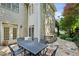 Charming backyard with stone patio, built-in grill, and outdoor dining area, perfect for entertaining at 3687 Canyon Ridge Ne Ct, Brookhaven, GA 30319