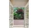 View from balcony features a beautiful, lush, green backyard with trees and vegetation at 3687 Canyon Ridge Ne Ct, Brookhaven, GA 30319
