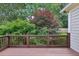 Inviting outdoor deck surrounded by lush landscaping and trees, creating a private backyard retreat at 3687 Canyon Ridge Ne Ct, Brookhaven, GA 30319