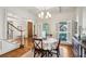 Bright dining room with hardwood floors, modern light fixture, and views to the front yard at 3687 Canyon Ridge Ne Ct, Brookhaven, GA 30319