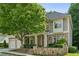 Charming two-story home featuring stone accents, a welcoming front porch, and a well-manicured lawn at 3687 Canyon Ridge Ne Ct, Brookhaven, GA 30319