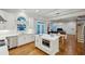 Bright open kitchen with stainless steel appliances, island, and views to dining and living areas at 3687 Canyon Ridge Ne Ct, Brookhaven, GA 30319