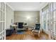 Comfortable office space with hardwood floors, natural light, and a relaxing sitting area at 3687 Canyon Ridge Ne Ct, Brookhaven, GA 30319