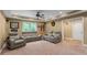 Entertainment room in basement featuring large screen tv, carpet, and multiple reclining chairs at 3705 Rolling Creek Dr, Buford, GA 30519
