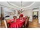 Elegant dining room featuring hardwood floors, chandelier, and views into other rooms at 3705 Rolling Creek Dr, Buford, GA 30519