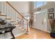 Grand foyer with hardwood floors, staircase and views into the dining and living room at 3705 Rolling Creek Dr, Buford, GA 30519