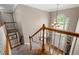 Open foyer featuring wood banisters, carpeted stairs, and a chandelier over the entry at 3705 Rolling Creek Dr, Buford, GA 30519