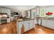 Kitchen island, white cabinets and eat in breakfast nook at 3705 Rolling Creek Dr, Buford, GA 30519