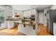 Kitchen with central island, stainless steel appliances, and hardwood floors at 3705 Rolling Creek Dr, Buford, GA 30519