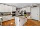 Kitchen with central island, stainless steel appliances, and white cabinets at 3705 Rolling Creek Dr, Buford, GA 30519