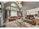 Bright living room with cathedral ceiling, large windows and hardwood floors at 3705 Rolling Creek Dr, Buford, GA 30519