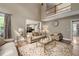 Open-concept living room with natural light and hardwood floors at 3705 Rolling Creek Dr, Buford, GA 30519