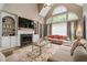 Bright living room with cathedral ceiling and marble fireplace at 3705 Rolling Creek Dr, Buford, GA 30519