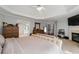 Spacious primary bedroom with tray ceilings, fireplace, sitting area and ensuite bath at 3705 Rolling Creek Dr, Buford, GA 30519