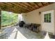 Cozy covered patio with outdoor seating, perfect for relaxing and enjoying the outdoors at 3705 Rolling Creek Dr, Buford, GA 30519