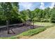 Community playground with slides, swings, and a gazebo, ideal for Gathering fun at 3705 Rolling Creek Dr, Buford, GA 30519