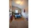 Spacious bedroom with comfortable bed, themed decor, carpeted floor, and natural lighting at 4271 Haywater Cv, Buford, GA 30519
