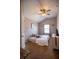 Bedroom with ceiling fan, natural light, carpet and simple decor for cozy atmosphere at 4271 Haywater Cv, Buford, GA 30519