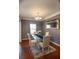 Inviting dining room showcasing a glass-top table and decor, creating an ideal setting for Gathering meals and gatherings at 4271 Haywater Cv, Buford, GA 30519