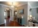 Inviting entryway with hardwood floors, neutral paint, arched doorways and elegant decorative touches at 4271 Haywater Cv, Buford, GA 30519
